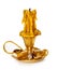 Burning vintage church candle wax in old gold candlestick on white background.