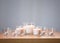 Burning white fragrance candles on wooden table