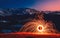 Burning Wirewool being used to make circle like light trails at Night on the Tarcu montain. Romania. Caras Severin