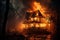 Burning wooden house at night, single family detached home completely destroyed by fire. Building in flames and smoke. Concept of