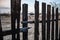 Burnt fence boards after a fire in a private house.