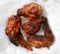 Burnt fried chicken wings on white tissue background  for reduced the cooking oil