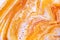 Burnt orange liquid and white foam mixing raster background. Colorful fluid splashes realistic illustration. Golden oil