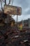 Burnt road sign, rubbish and landscape after bush fires Australia