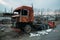 Burnt rusty truck in abandoned industrial area