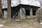 Burnt wooden country house. Country residence after a fire. Black charred window walls