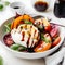 Burrata cheese and grilled peaches salad with ripe tomatoes, basil and balsamic sauce topping on a light background. Close up.