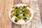 burrata cheese salad with black olives, lamb\\\'s lettuce shoots, kumato tomato and olive oil and oregano