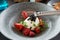 Burrata cheese with seaweed caviar and berries