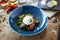 Burrata with paprika-truffle jam and cherry-cluster tomato salad. Delicious healthy Italian traditional food closeup