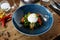 Burrata with paprika-truffle jam and cherry-cluster tomato salad. Delicious healthy Italian traditional food closeup