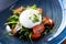 Burrata with paprika-truffle jam and cherry-cluster tomato salad. Delicious healthy Italian traditional food closeup