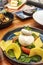 Burrata recipe with skinless tomato slices, basil and spinach