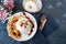 burrata is served with roasted caramelized pear and pine nuts. Close-up.