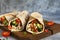 Burrito - mexican dish with corn tortilla, jasse, vegetables and sauce. Tortilla stuffed