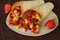 Burritos wraps with fruit.