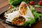 Burritos wraps with minced beef and vegetables