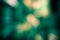 Burst zoom of bokeh light in gradient green and yellow background