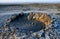 Bursting the bubble mud volcanoes with natural gas in Gobustan, famous landmark,Azerbaijan,Caucasus