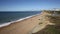 Burton Bradstock beach West Dorset England uk with people enjoying a beautiful day