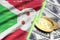 Burundi flag and cryptocurrency growing trend with two bitcoins on dollar bills