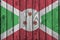 Burundi flag depicted in bright paint colors on old wooden wall. Textured banner on rough background