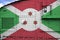 Burundi flag depicted on side part of military armored tank closeup. Army forces conceptual background