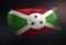 Burundi Flag Made of Metallic Brush Paint on Grunge Dark Wall
