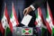 Burundi flags, hand dropping ballot card into a box - voting, election concept