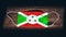 Burundi National Flag at medical, surgical, protection mask on black wooden background. Coronavirus Covidâ€“19, Prevent infection
