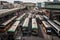 bus depot in bustling metropolis, with buses and people coming and going