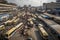 bus depot in bustling metropolis, with buses and people coming and going