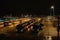 bus depot at night, with buses lined up and waiting for the morning commute