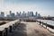 bus depot with view of city skyline in the background, showing off the metropolis