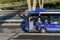 A bus driver at the wheel of his bus waiting at a bus stop