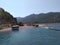 Bus, sea, sky and tourists in water at Girl Sand Beach. Here is famous shoal, a place of pilgrimage of tourists