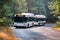 Bus shuttling tourists between various interest point located in Yosemite National Park