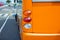 Bus is at the stop. Rear view - orange version