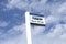 Bus stop sign sky background blue white clouds view below information public transport school old age pensioner travel free coach