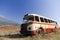 Bus wreck in arid landscape