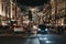 Buses, cars and pedestrians under angel Christmas lights on Regent Street, London, UK, in the evening, motion blur