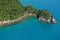 Bush clad hills reach down to the sea in New Zealand`s Abel Tasman National Park