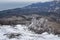 Bush frozen in ice on Demerdzhi mountain slope in spring. Crimea