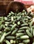 A bushel of very fresh cucumber is a lovely display at a farmer`s market