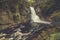 Bushkill Falls in Poconos, PA, surrounded by lush fall foliage