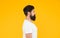 Bushy beard hipster man barbershop client yellow background, perfect side view concept