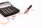 Business abstract - calculator and elegant pen.