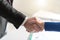 Business agreement with handshake, light effect