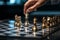 Business analogy Hand engages chessboard, symbolizing calculated planning and strategic comparisons