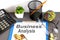 BUSINESS ANALYSIS written on the paper with office tools